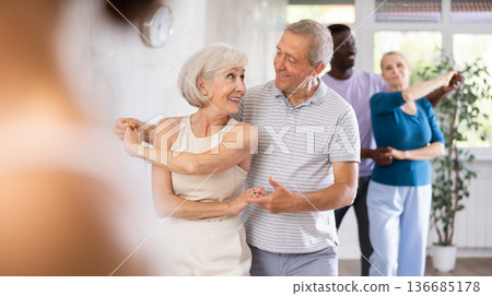 Group of multiethnic mature people dancing social dance Group of multiethnic mature people dancing social dance 136685178