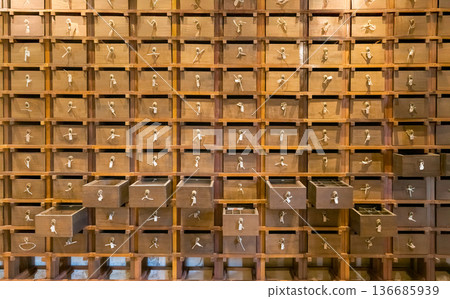 Traditional chinese pharmacy shop. Ancient herbs pharmacy cabinet wooden drawers in background Traditional chinese pharmacy shop. Ancient herbs pharmacy cabinet wooden drawers in background 136685939