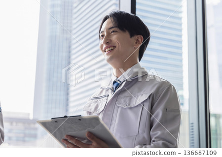 A young man working on clothes A young man working on clothes 136687109