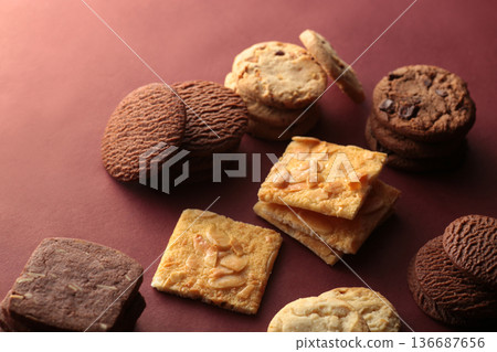 A photo of cookies with soft shadows taken against a warm background A photo of cookies with soft shadows taken against a warm background 136687656