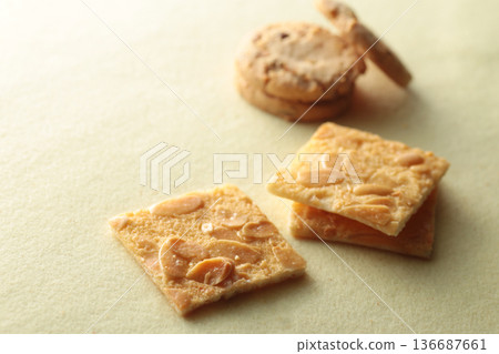 A photo of cookies with soft shadows taken against a warm background A photo of cookies with soft shadows taken against a warm background 136687661