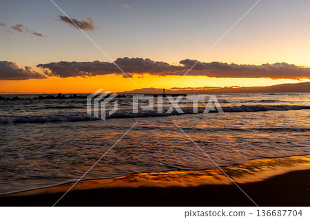 The Shonan sea lit up by the setting sun The Shonan sea lit up by the setting sun 136687704