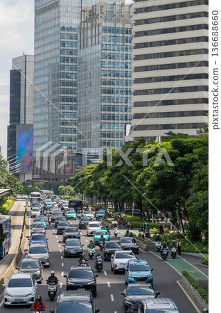 Traffic congestion and high-rise offices in central Jakarta / Urban economy and commuting in Indonesia's capital city Traffic congestion and high-rise offices in central Jakarta / Urban economy and commuting in Indonesia's capital city 136688660