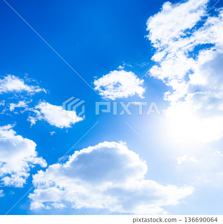 A simple landscape of a refreshing blue sky, clouds and sun A simple landscape of a refreshing blue sky, clouds and sun 136690064