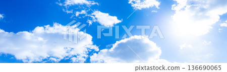 A simple landscape of a refreshing blue sky, clouds and sun 136690065