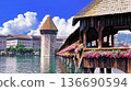 Flower-filled Chapel Bridge and the cityscape of Lucerne 136690594