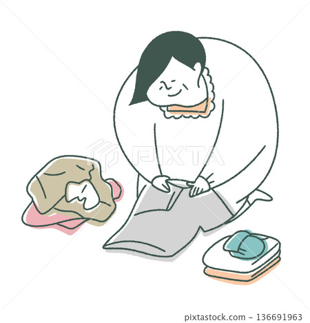 Elderly woman folding laundry Elderly woman folding laundry 136691963