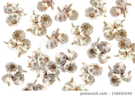 Multiple whole garlic bulbs arranged in a seamless pattern, isolated on white background. Concept of organic food and culinary spice Multiple whole garlic bulbs arranged in a seamless pattern, isolated on white background. Concept of organic food and culinary spice 136692049