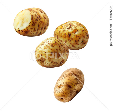 Fresh raw potatoes with skin, scattered and isolated on white background, concept of organic food ingredients Fresh raw potatoes with skin, scattered and isolated on white background, concept of organic food ingredients 136692069