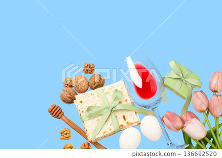 Passover foods are arranged alongside wine and flowers 136692520