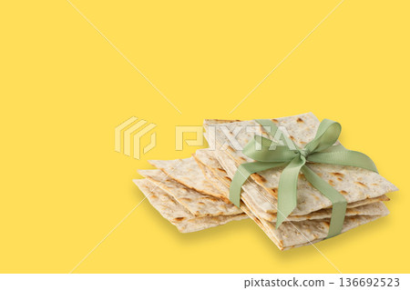 Matzah stacked and tied with ribbon ready for Passover meal 136692523