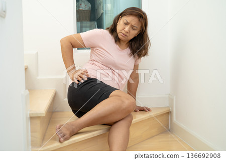 Asian lady woman patient fall down the stairs because slippery surfaces. Asian lady woman patient fall down the stairs because slippery surfaces. 136692908
