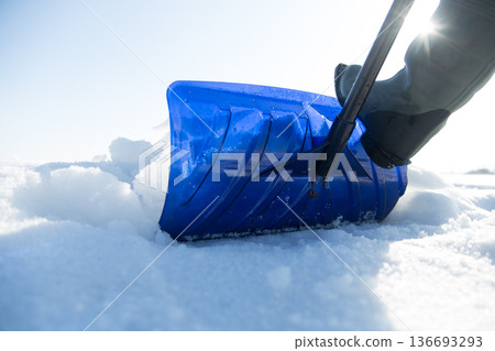 Clearing snow with a shovel Clearing snow with a shovel 136693293