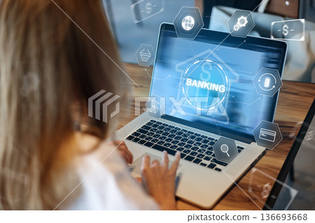 User makes a banking transaction using a laptop with online payment options displayed 136693668