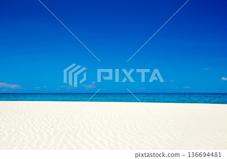Beautiful beach. Tropical beach. Holiday and vacation concept. Sand, blue sea water, turquoise ocean, sun sky white clouds Beautiful beach. Tropical beach. Holiday and vacation concept. Sand, blue sea water, turquoise ocean, sun sky white clouds 136694481
