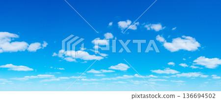 Blue Sky background with tiny Clouds. Panorama background 136694502