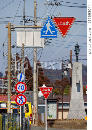 Scenery of Japanese road signs (stop, crosswalk, speed limit) and stone lanterns Scenery of Japanese road signs (stop, crosswalk, speed limit) and stone lanterns 136695044