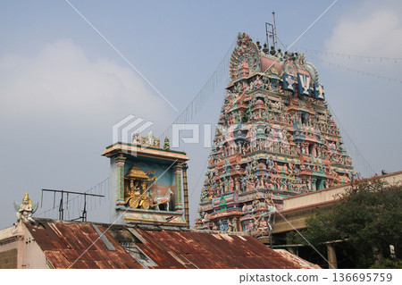 Horse chariot and carved tower of the Arulmigu Sri Parthasarathyswamy Temple, Chennai, India. Horse chariot and carved tower of the Arulmigu Sri Parthasarathyswamy Temple, Chennai, India. 136695759
