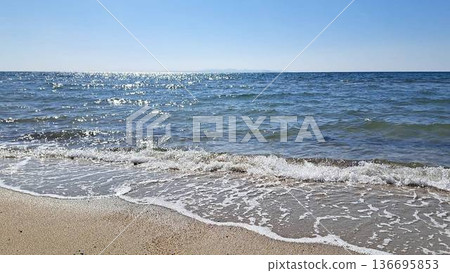 Sandy beach and blue sea Sandy beach and blue sea 136695853