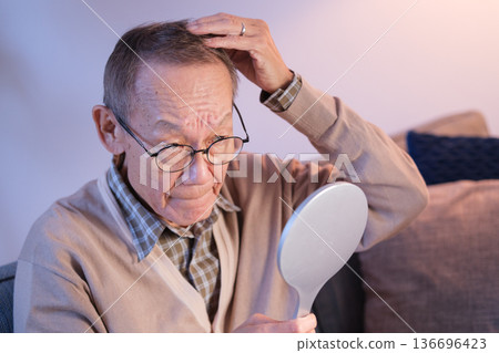 Senior men hair care thinning hair 136696423