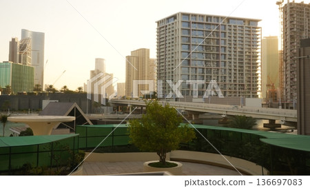 Modern urban skyline with residential buildings and green landscaping Modern urban skyline with residential buildings and green landscaping 136697083