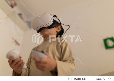 Young child exploring virtual reality metaverse concept Young child exploring virtual reality metaverse concept 136697472