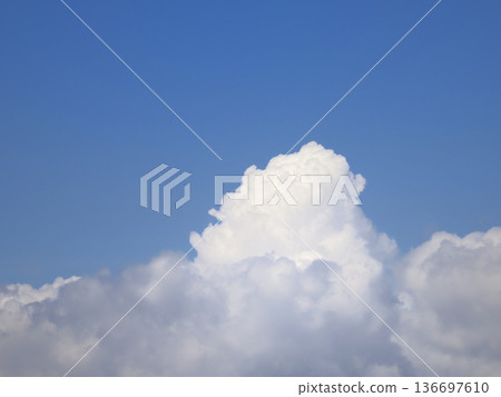 Cumulus clouds rising from below Cumulus clouds rising from below 136697610
