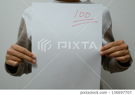 A child is happy with a test result of 100 points 136697707