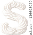 Decorative S shaped with creamy white swirls of whipped cream 136698020