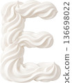 White whipped cream swirls forming the letter E 136698022