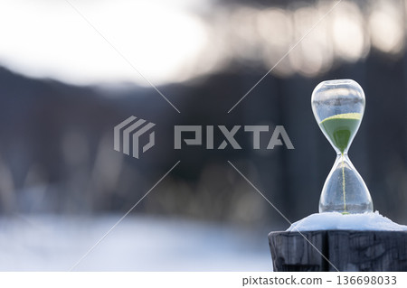 Snowy landscape and hourglass Snowy landscape and hourglass 136698033
