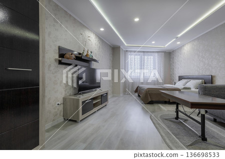 Modern Studio Interior with TV Stand and Minimalist Wardrobe Modern Studio Interior with TV Stand and Minimalist Wardrobe 136698533