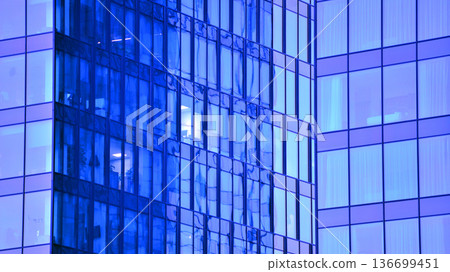 Modern sustainable glass office buildings. Exterior view of corporate headquarters glass buildings architecture.Glass windows in energy-efficient buildings. Financial business center buildings.  136699451