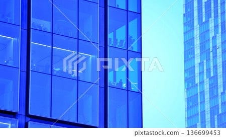 Modern sustainable glass office buildings. Exterior view of corporate headquarters glass buildings architecture.Glass windows in energy-efficient buildings. Financial business center buildings.  136699453