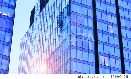 Modern sustainable glass office buildings. Exterior view of corporate headquarters glass buildings architecture.Glass windows in energy-efficient buildings. Financial business center buildings.  136699466
