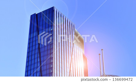 Modern sustainable glass office buildings. Exterior view of corporate headquarters glass buildings architecture.Glass windows in energy-efficient buildings. Financial business center buildings. Modern sustainable glass office buildings. Exterior view of corporate headquarters glass buildings architecture.Glass windows in energy-efficient buildings. Financial business center buildings. 136699472