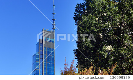 Modern sustainable glass office buildings. Exterior view of corporate headquarters glass buildings architecture.Glass windows in energy-efficient buildings. Financial business center buildings. Modern sustainable glass office buildings. Exterior view of corporate headquarters glass buildings architecture.Glass windows in energy-efficient buildings. Financial business center buildings. 136699529