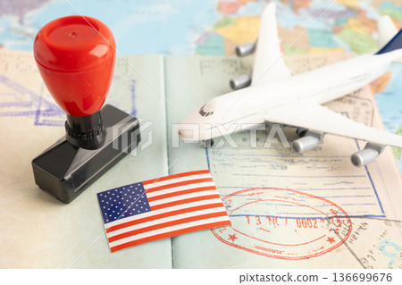 US America flag with passport and airplane for travel. 136699676