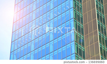 Modern sustainable glass office buildings. Exterior view of corporate headquarters glass buildings architecture.Glass windows in energy-efficient buildings. Financial business center buildings. Modern sustainable glass office buildings. Exterior view of corporate headquarters glass buildings architecture.Glass windows in energy-efficient buildings. Financial business center buildings. 136699860