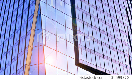 Modern sustainable glass office buildings. Exterior view of corporate headquarters glass buildings architecture.Glass windows in energy-efficient buildings. Financial business center buildings.  136699870
