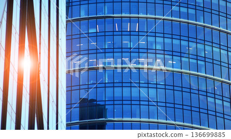 Modern sustainable glass office buildings. Exterior view of corporate headquarters glass buildings architecture.Glass windows in energy-efficient buildings. Financial business center buildings. Modern sustainable glass office buildings. Exterior view of corporate headquarters glass buildings architecture.Glass windows in energy-efficient buildings. Financial business center buildings. 136699885
