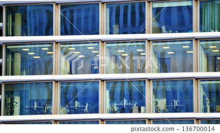 Exterior view of corporate headquarters glass buildings architecture. Modern sustainable glass office buildings. Glass windows in energy-efficient buildings. Financial business center buildings. Exterior view of corporate headquarters glass buildings architecture. Modern sustainable glass office buildings. Glass windows in energy-efficient buildings. Financial business center buildings. 136700014