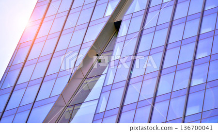 Exterior view of corporate headquarters glass buildings architecture. Modern sustainable glass office buildings. Glass windows in energy-efficient buildings. Financial business center buildings. Exterior view of corporate headquarters glass buildings architecture. Modern sustainable glass office buildings. Glass windows in energy-efficient buildings. Financial business center buildings. 136700041
