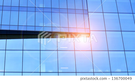 Exterior view of corporate headquarters glass buildings architecture. Modern sustainable glass office buildings. Glass windows in energy-efficient buildings. Financial business center buildings.  136700049
