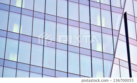 Exterior view of corporate headquarters glass buildings architecture. Modern sustainable glass office buildings. Glass windows in energy-efficient buildings. Financial business center buildings. Exterior view of corporate headquarters glass buildings architecture. Modern sustainable glass office buildings. Glass windows in energy-efficient buildings. Financial business center buildings. 136700055