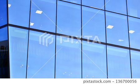Exterior view of corporate headquarters glass buildings architecture. Modern sustainable glass office buildings. Glass windows in energy-efficient buildings. Financial business center buildings. Exterior view of corporate headquarters glass buildings architecture. Modern sustainable glass office buildings. Glass windows in energy-efficient buildings. Financial business center buildings. 136700056