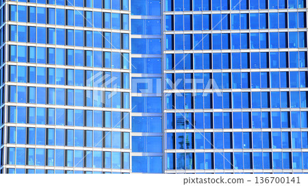 Exterior view of corporate headquarters glass buildings architecture. Modern sustainable glass office buildings. Glass windows in energy-efficient buildings. Financial business center buildings. Exterior view of corporate headquarters glass buildings architecture. Modern sustainable glass office buildings. Glass windows in energy-efficient buildings. Financial business center buildings. 136700141