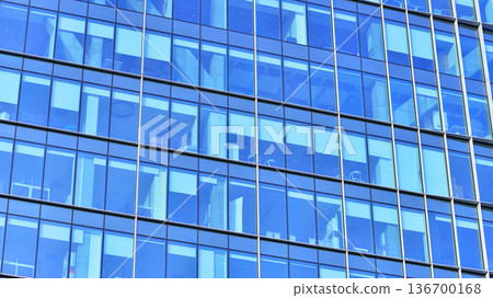 Exterior view of corporate headquarters glass buildings architecture. Modern sustainable glass office buildings. Glass windows in energy-efficient buildings. Financial business center buildings. Exterior view of corporate headquarters glass buildings architecture. Modern sustainable glass office buildings. Glass windows in energy-efficient buildings. Financial business center buildings. 136700168