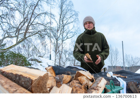 Rural Winter Lifestyle and Firewood Preparation. 136700613