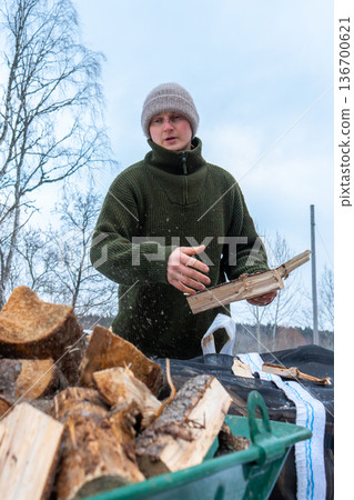 Rural Winter Lifestyle and Firewood Preparation. Rural Winter Lifestyle and Firewood Preparation. 136700621
